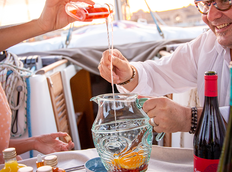 Sangria Workshop & Sailing Cruise. A group of friends drinking and having fun on a Boat